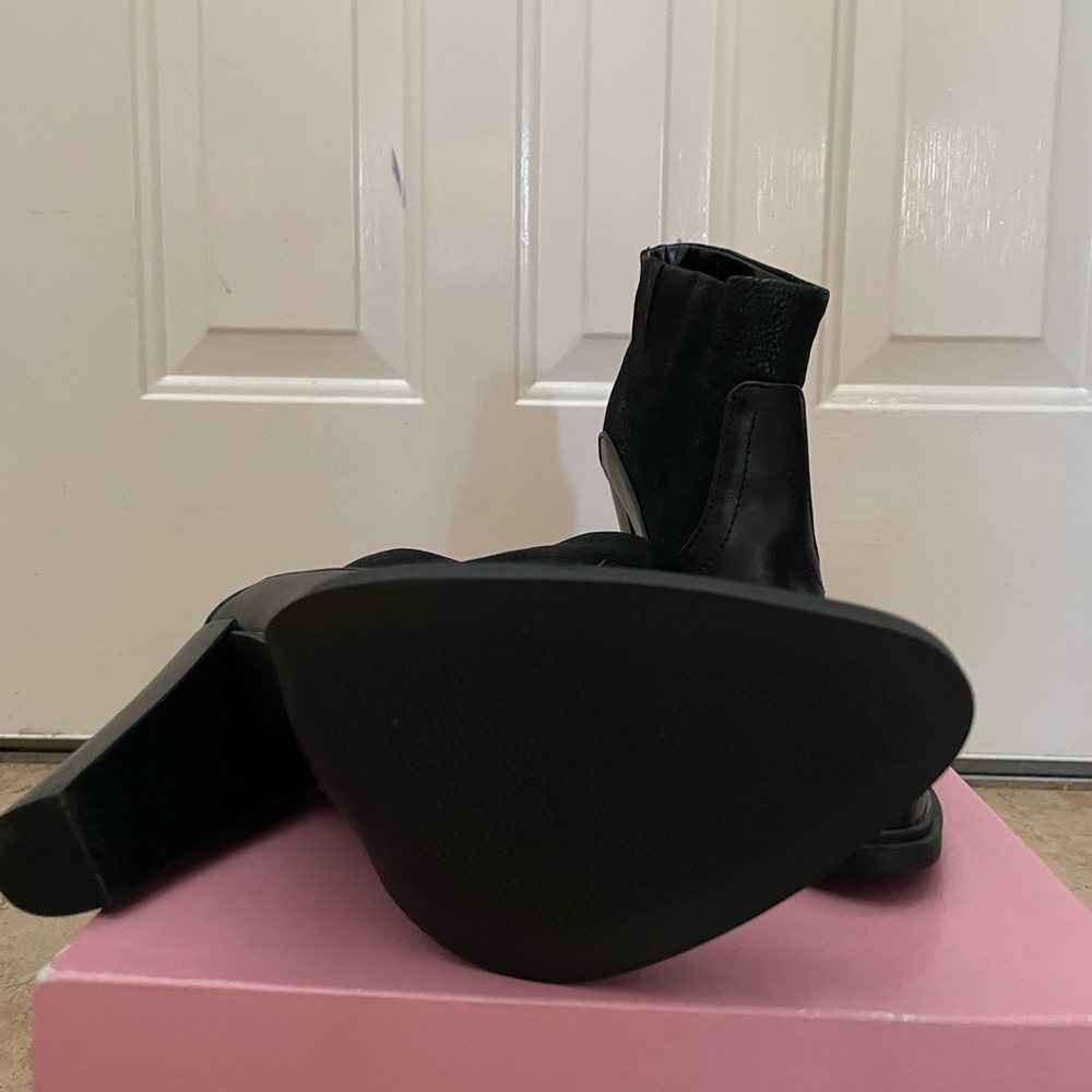 Womens bootie. Brand new. Four inch heel.